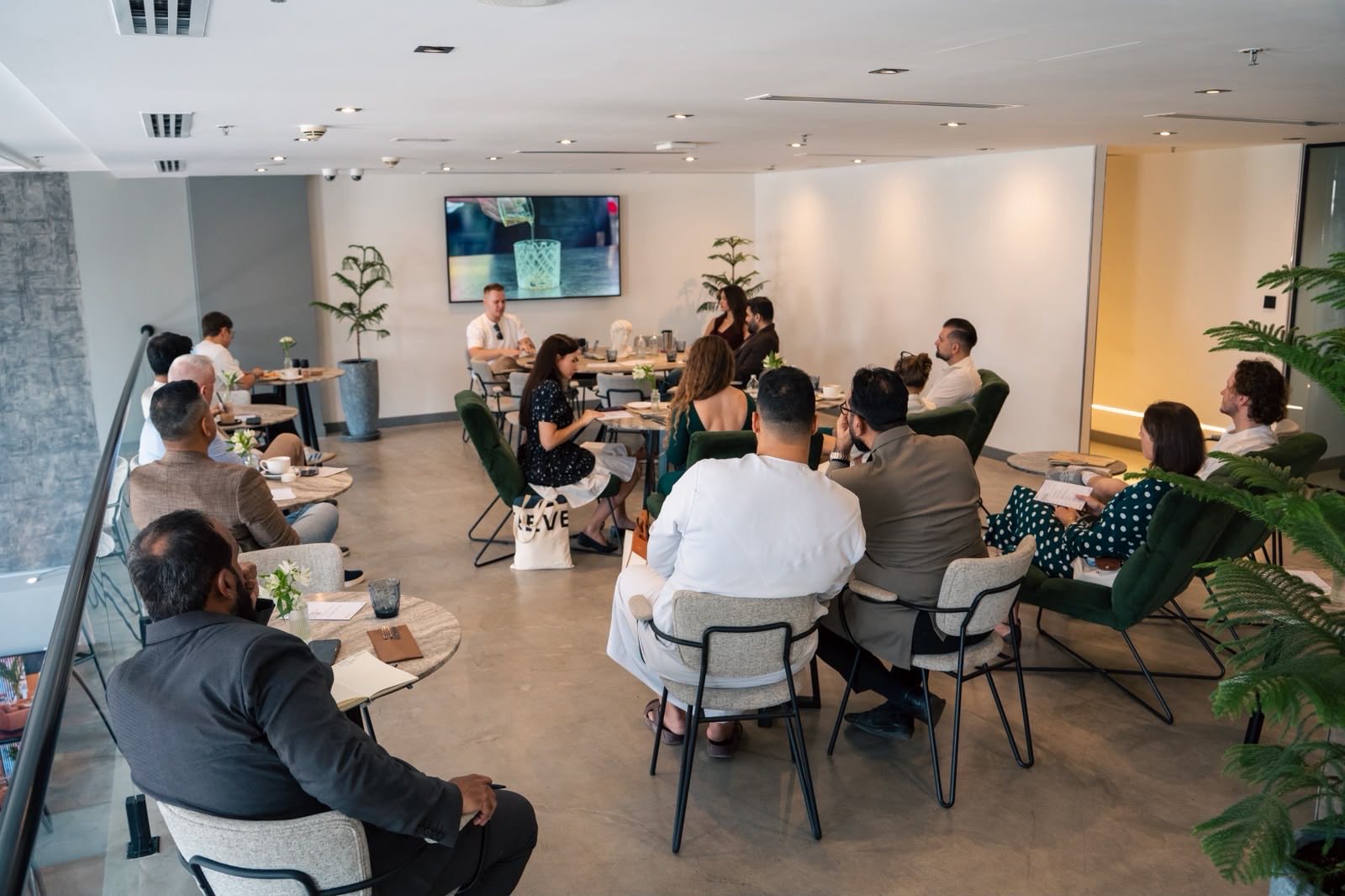 Venue interior with Gregory Shevchenko speaking at the Semantica event, Dubai